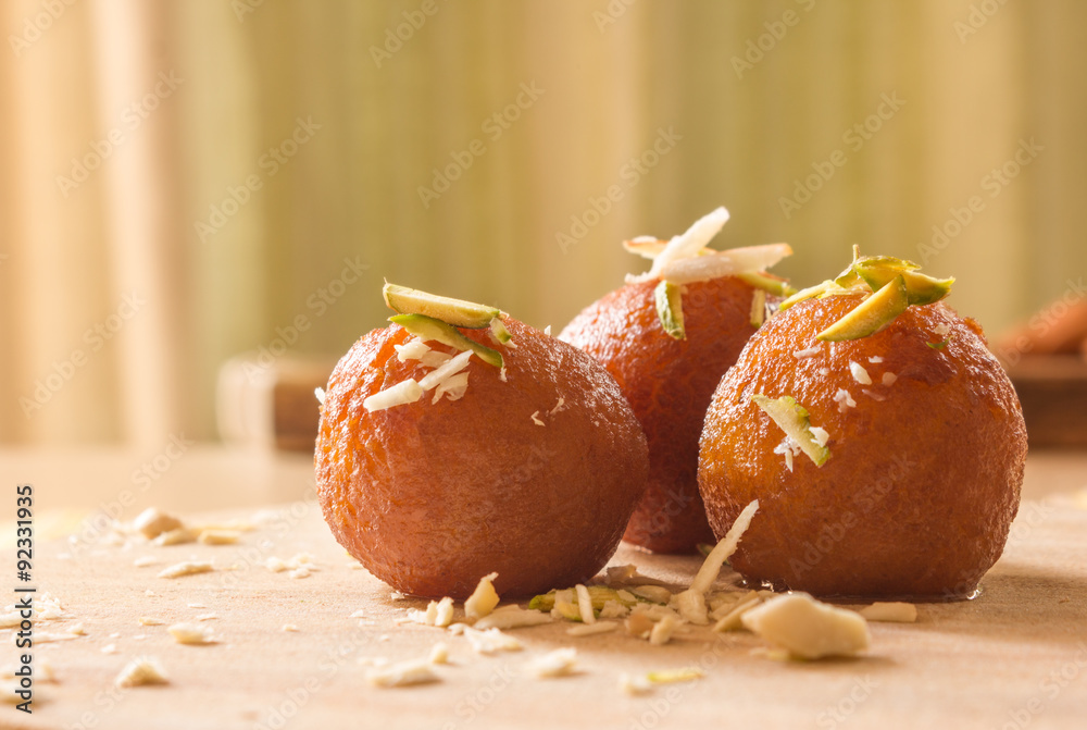 Gulab Jamuns, Indian dessert topped with Cashews, pistachio and almonds