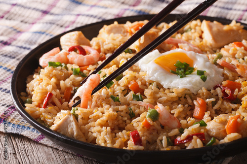 Fried rice nasi goreng with chicken and shrimp close-up horizontal

