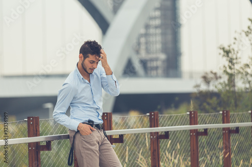 Young handsome man posing in an urban context