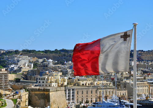 Maltese flag and cityscape