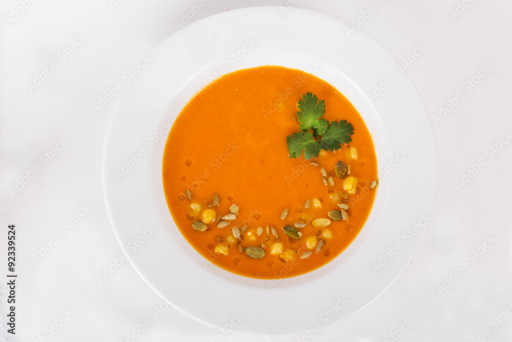 Pumpkin soup with seeds and parsley on top of the menu Pumpkin soup with seeds and parsley on top of the menu