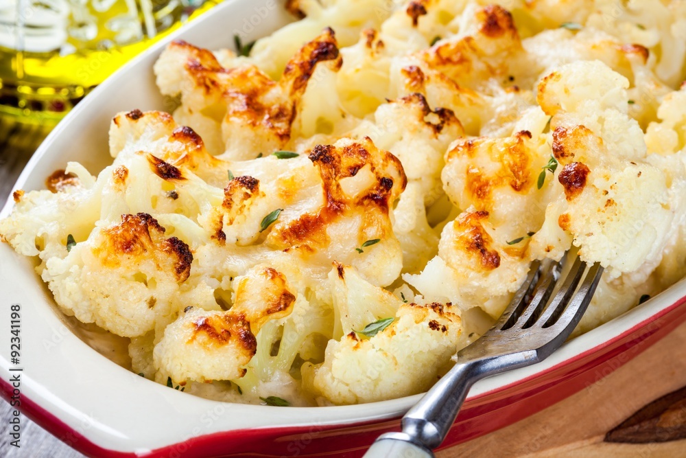 Cauliflower and cheese gratin in the baking dish closeup Cauliflower and cheese gratin in the baking dish closeup