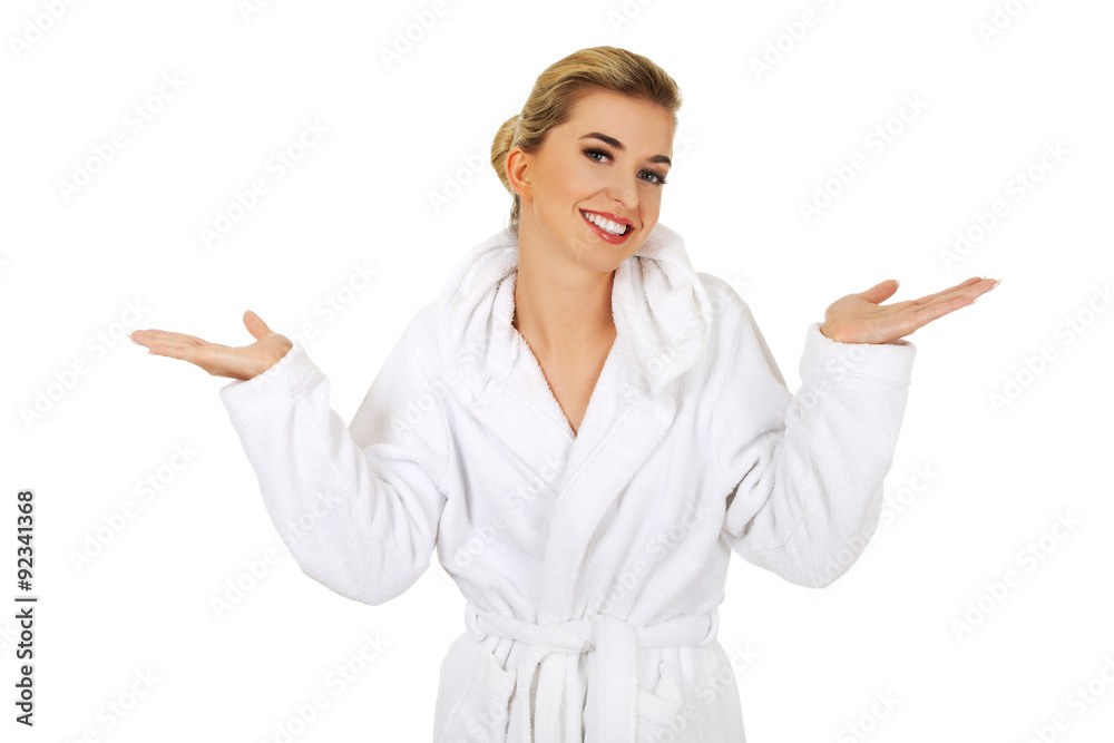 Young happy woman after bath holding somathing. Young happy woman after bath holding somathing.