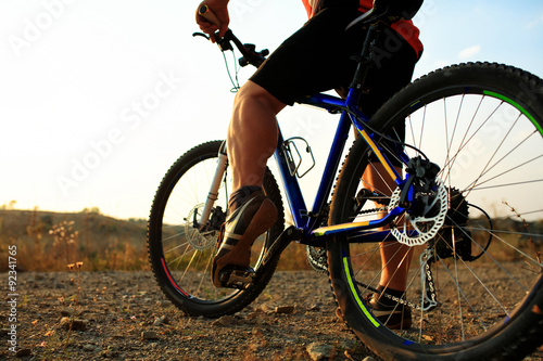 low angle view of cyclist riding mountain bike 