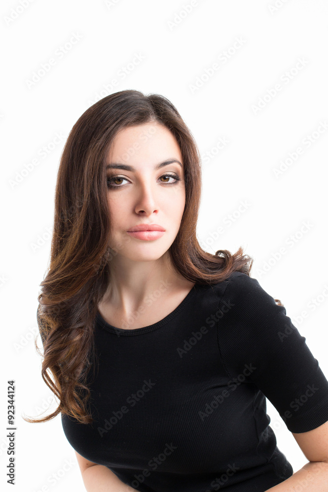 Beautiful caucasian woman dressed in black dress posing at studio. Beautiful caucasian woman dressed in black dress posing at studio.