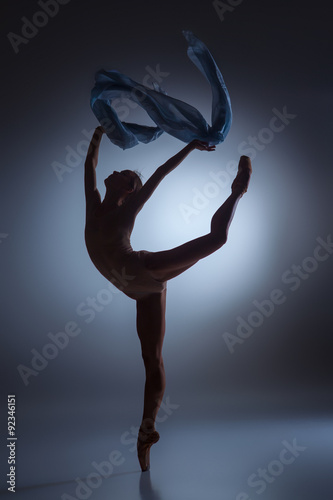 The beautiful ballerina dancing with blue veil