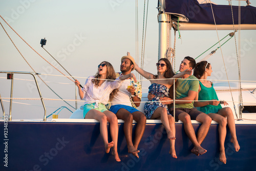 Merry company celebrates birthday on a yacht. © DenisProduction.com