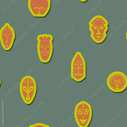 Seamless background with African ritual masks for your design