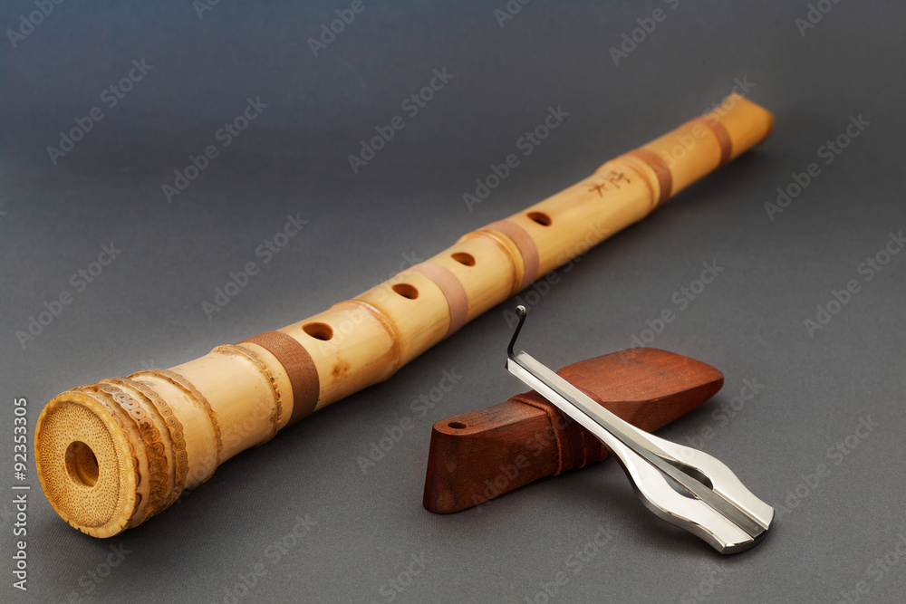Traditional bamboo Japanese flute with Jew's harp on gray background Stock  Photo | Adobe Stock