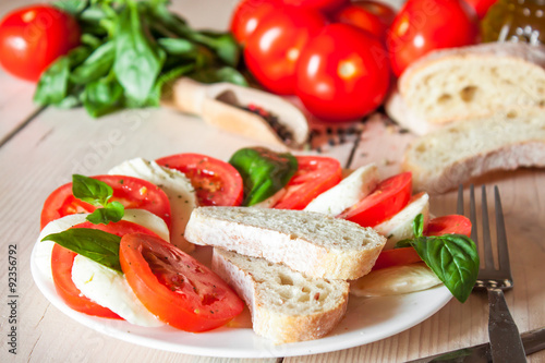 Caprese with tomatoes, mozzarella and basil