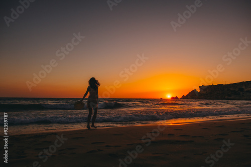 Sea beach girl silhouette, sunset