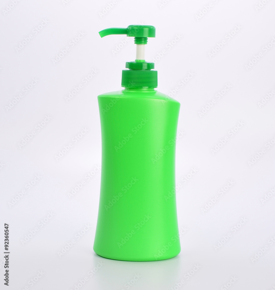 green plastic bottle on white background