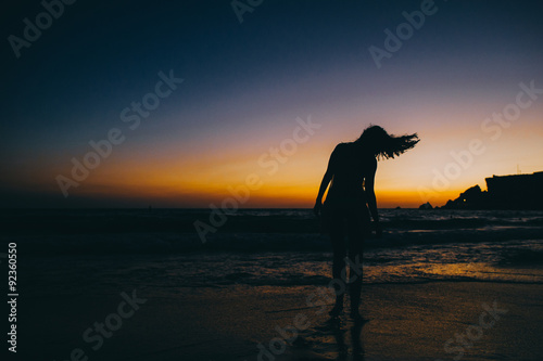 Sea beach girl silhouette, sunset