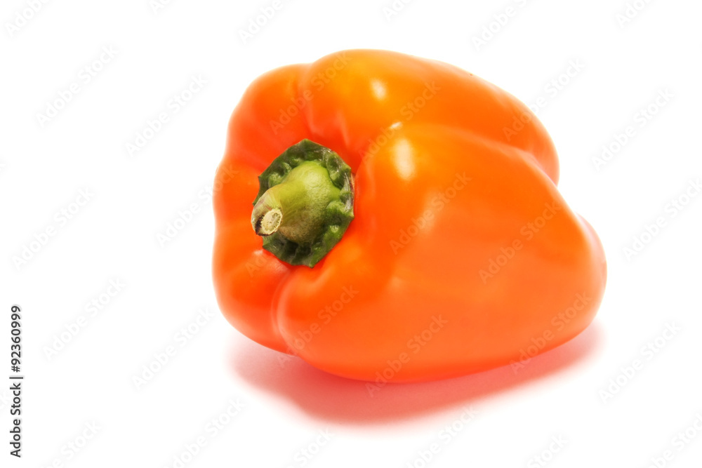 Large orange bell pepper on a white background. Large orange bell pepper on a white background.