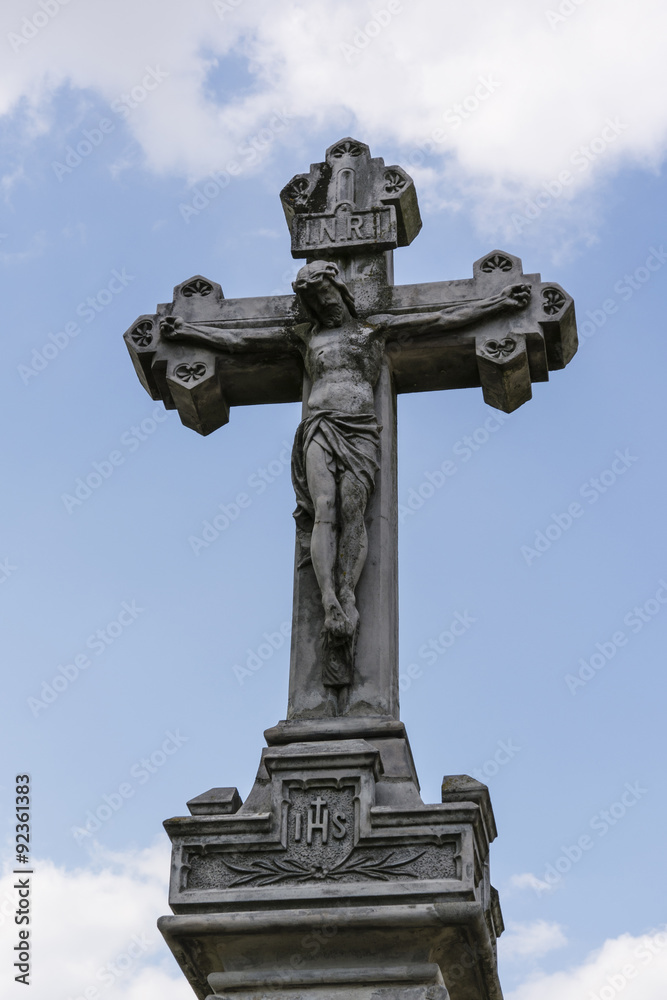 stone cross with Jesus