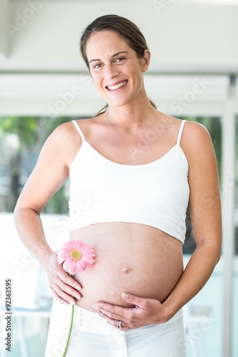 Portrait of woman with flower at home Free Download Portrait of woman with flower at home - GFXLoad