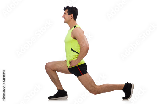 Young man exercising on white