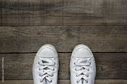 white shoes on wooden background