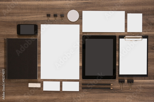Set of mock-up business brand template on wooden desk.