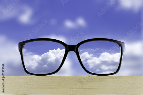 Clear vision of cloud and sky behind glasses