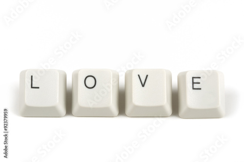 love from scattered keyboard keys on white