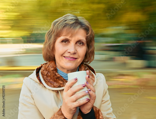 middle age woman with cup