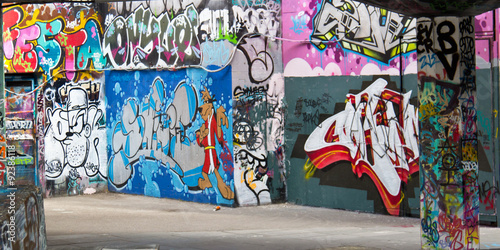 Graffiti spray paint art on a wall in a public space