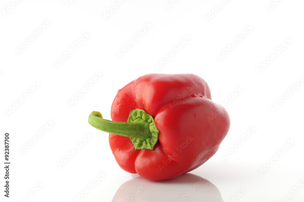 High Resolution Image Of Red Bell Pepper With Green Stem over White Background, Shot In Studio.