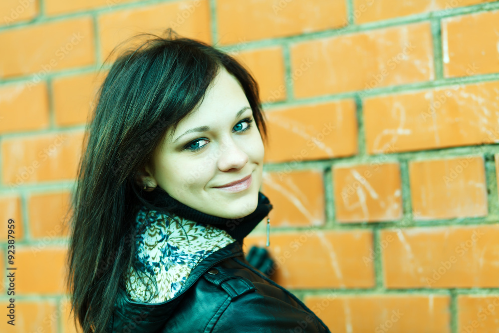 Brunette girl`s portrait on grunge background. Brunette girl`s portrait on grunge background.