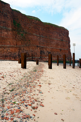 wavebreakers and cliff on heligoland island photo