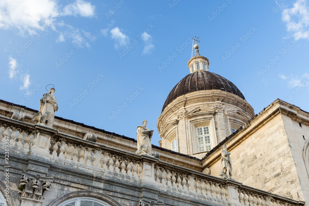 Statues and dome of the historical Cathedral of the Assumption of the Virgin Mary in Dubrovnik, Croatia.