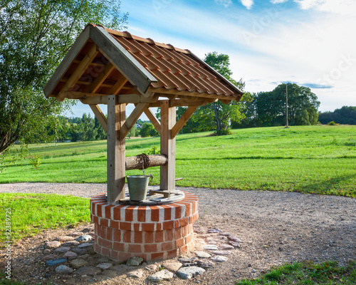 Retro wooden well water photo