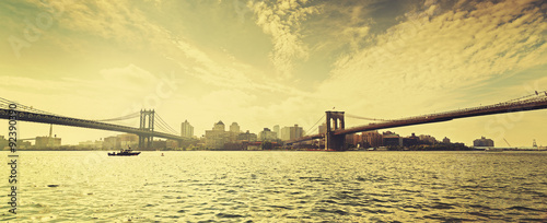 Old film retro style New York waterfront view with two bridges, USA.