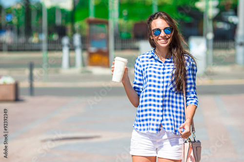 Young woman with glass of coffee outdoor © travnikovstudio