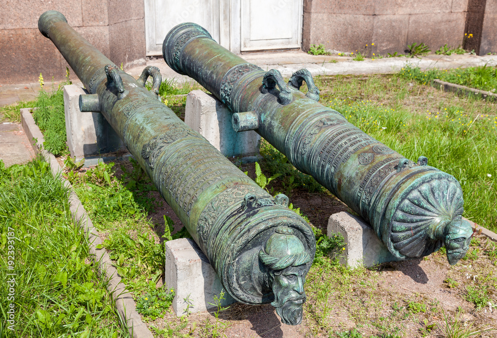 Ancient bronze cannons in Artillery museum in summer sunny day Ancient bronze cannons in Artillery museum in summer sunny day