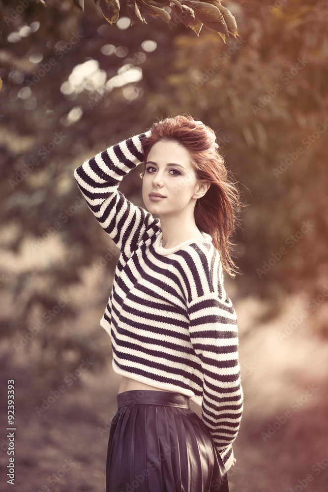 Fototapeta premium girl in striped sweater