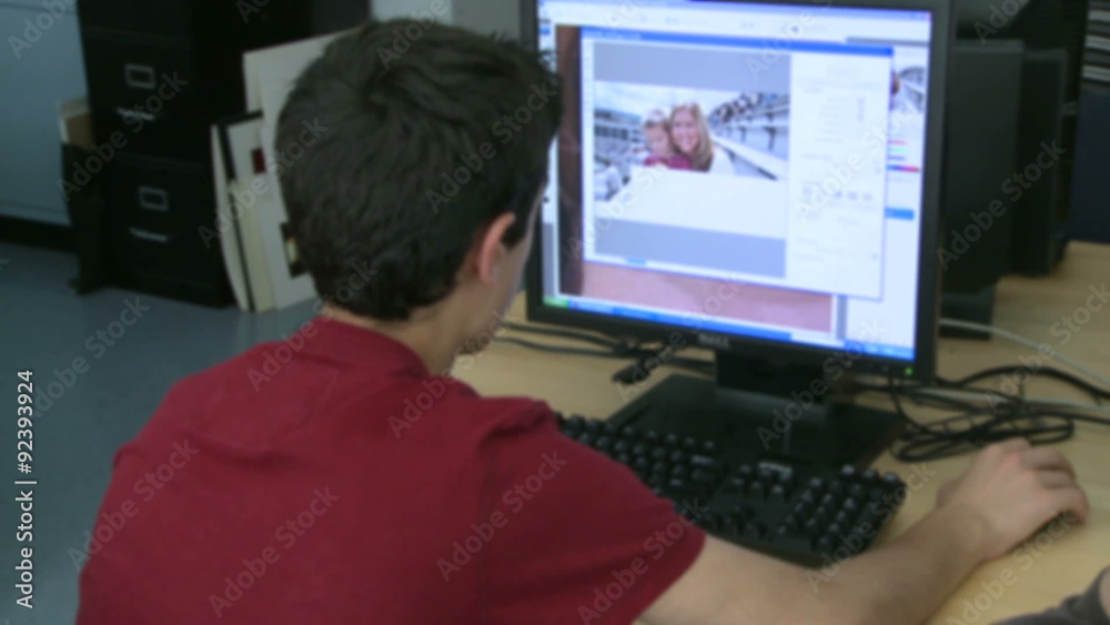 Grammar school student looking at computer screen Grammar school student looking at computer screen