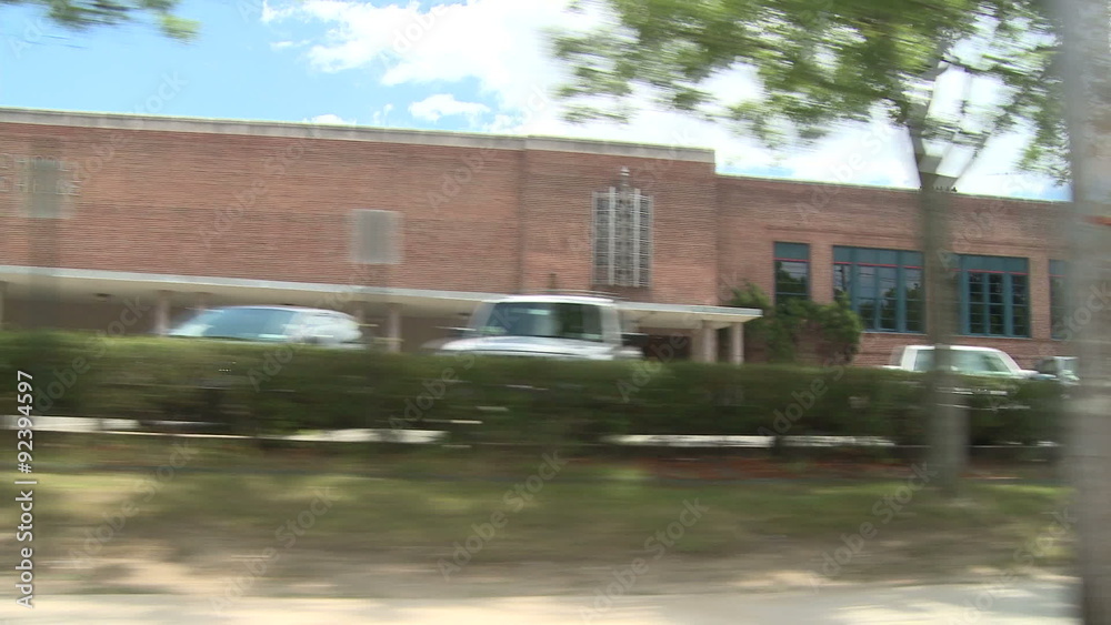 Driving passed brick building Driving passed brick building