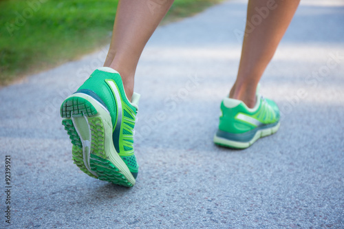 jogging woman in green running shoes