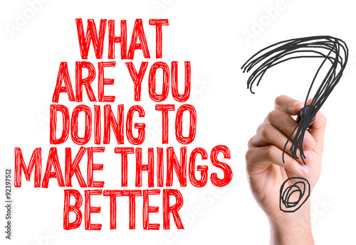 Hand with marker writing: What Are You Doing To Make Things Better?