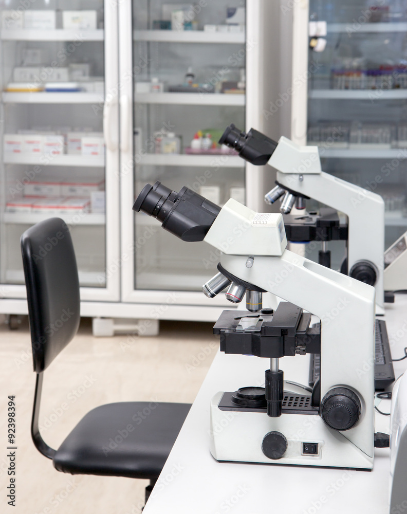 microscopes in a laboratory microscopes in a laboratory