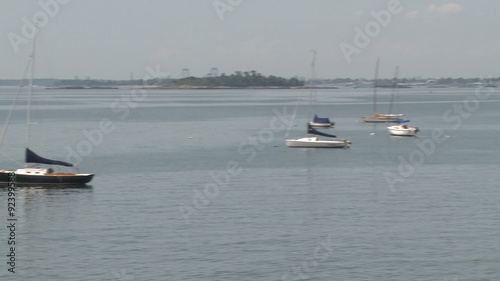 Small boats moored in the harbor photo