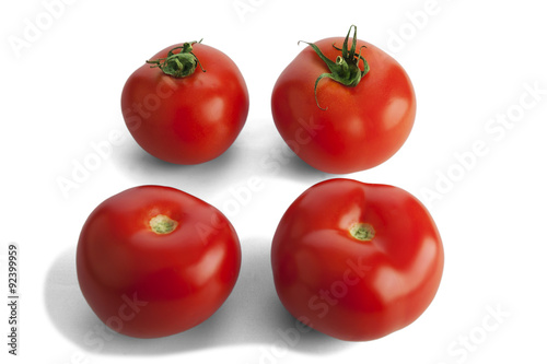 Fresh ripe tomatoes isolated on white.