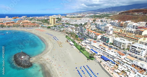 Beautiful aerial flight over Los Cristianos beach (Playa de las America), Canary Island Tenerife, Spain