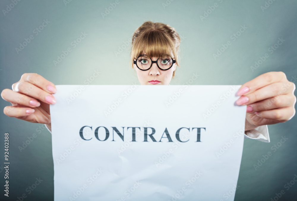 unhappy business woman showing crumpled contract unhappy business woman showing crumpled contract