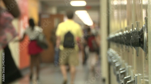 Close up of lockers with students in background