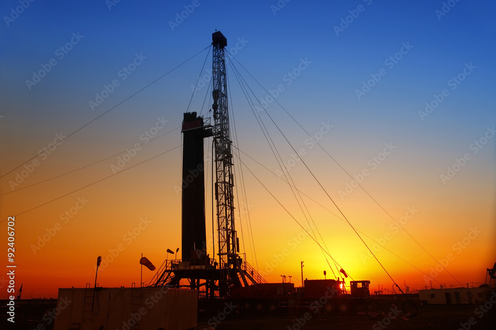 In the evening, the silhouette of oilfield derrick