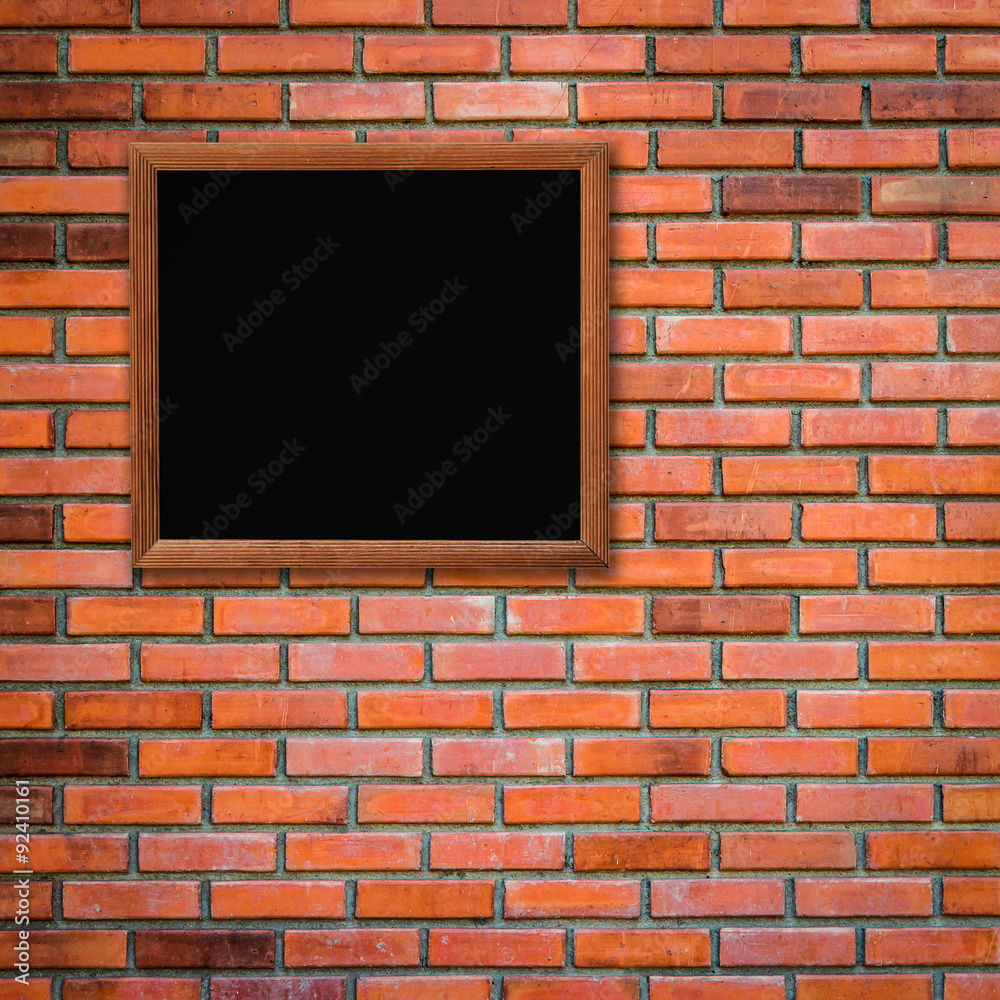 Fototapeta premium old wood frame on red brick wall background with space for text