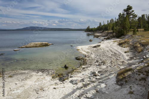 Wavy shoreline of Yellowstone Lake, with white limy beach, Wyomi