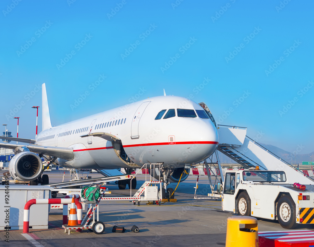 Passenger plane in the airport. Aircraft maintenance. Passenger plane in the airport. Aircraft maintenance.